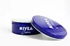 Prague, CZECH REPUBLIC - DECEMBER 30, 2018: Nivea Creme, the world's famous skin cream skin cream in a metal jar laid on white background