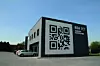 REA-Niederlassung in Polen mit QR Code.